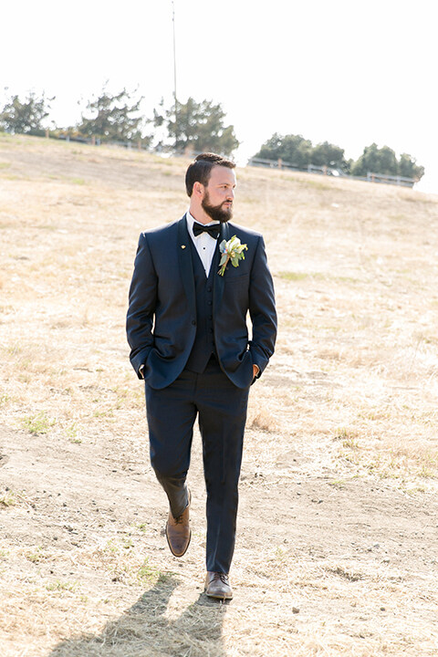 navy suit with cowboy boots